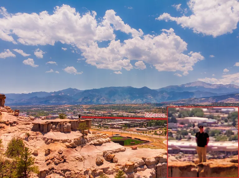 Michael near the top of Pulpit Rock with Pikes Peak in the background with an zoomed in portion of Michael labeled 'enhance'
